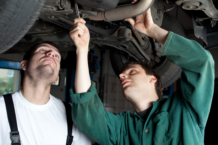 Car Mechanics repairing car